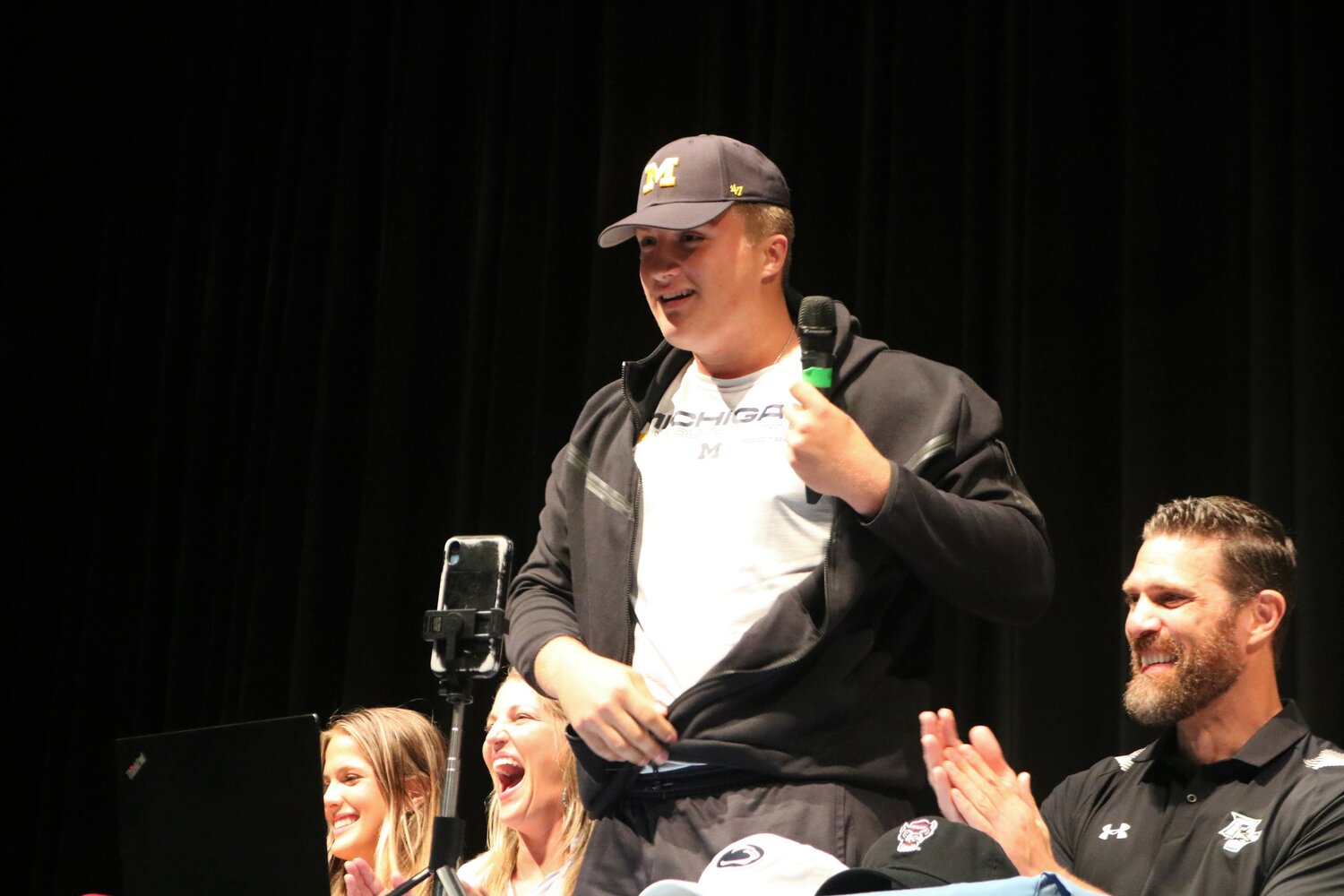 Ponte Vedra High junior offensive lineman Jake Guarnera commits to play football at the University of Michigan during an announcement ceremony in the school’s auditorium April 28.